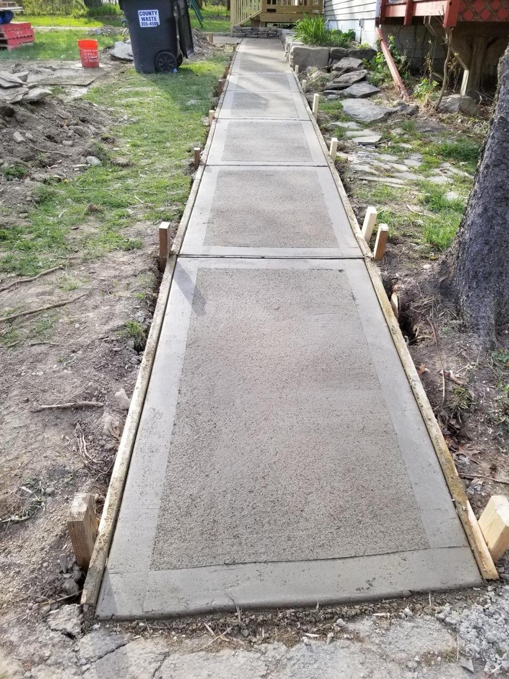 Concrete walkway with smooth-trowel border by Tigre General Construction, Dutchess County NY