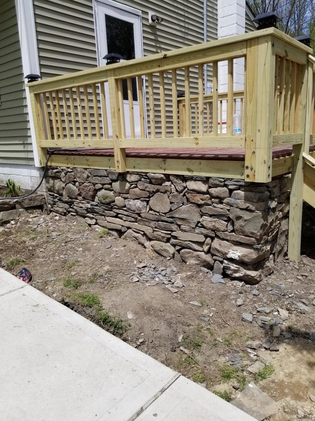 Deck with fieldstone foundation wall by Tigre General Construction, Dutchess County NY